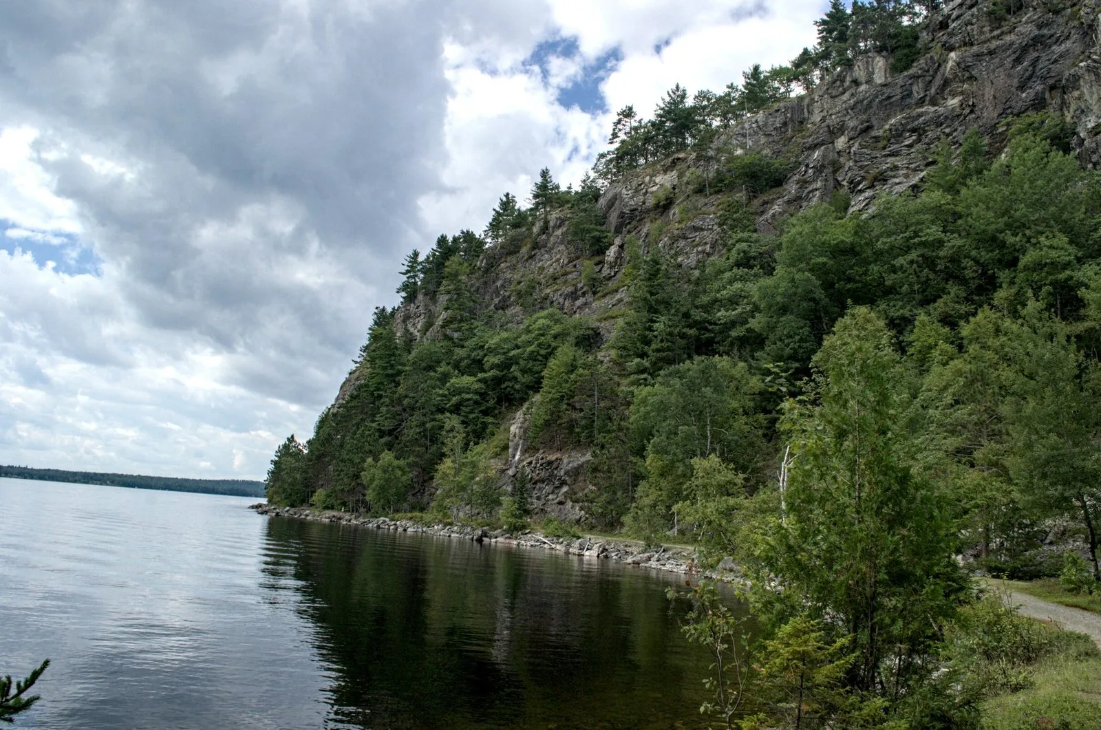 Shoreline trail on the Kineo peninsula with Moosehead Lake through the trees